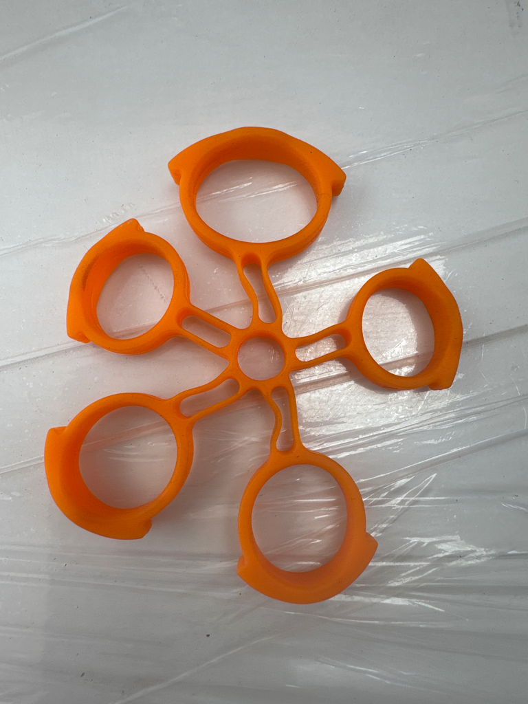 EXTENSOR EJERCITADOR DE DEDO TIPO ANILLO C/NARANJA